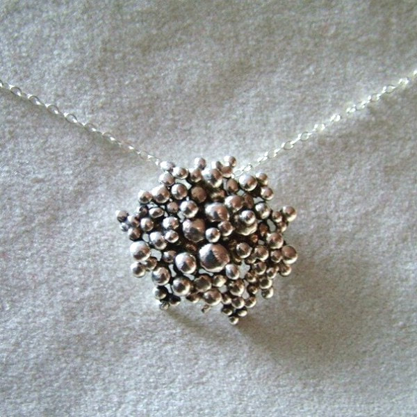 necklace made of multitude of small metal drops